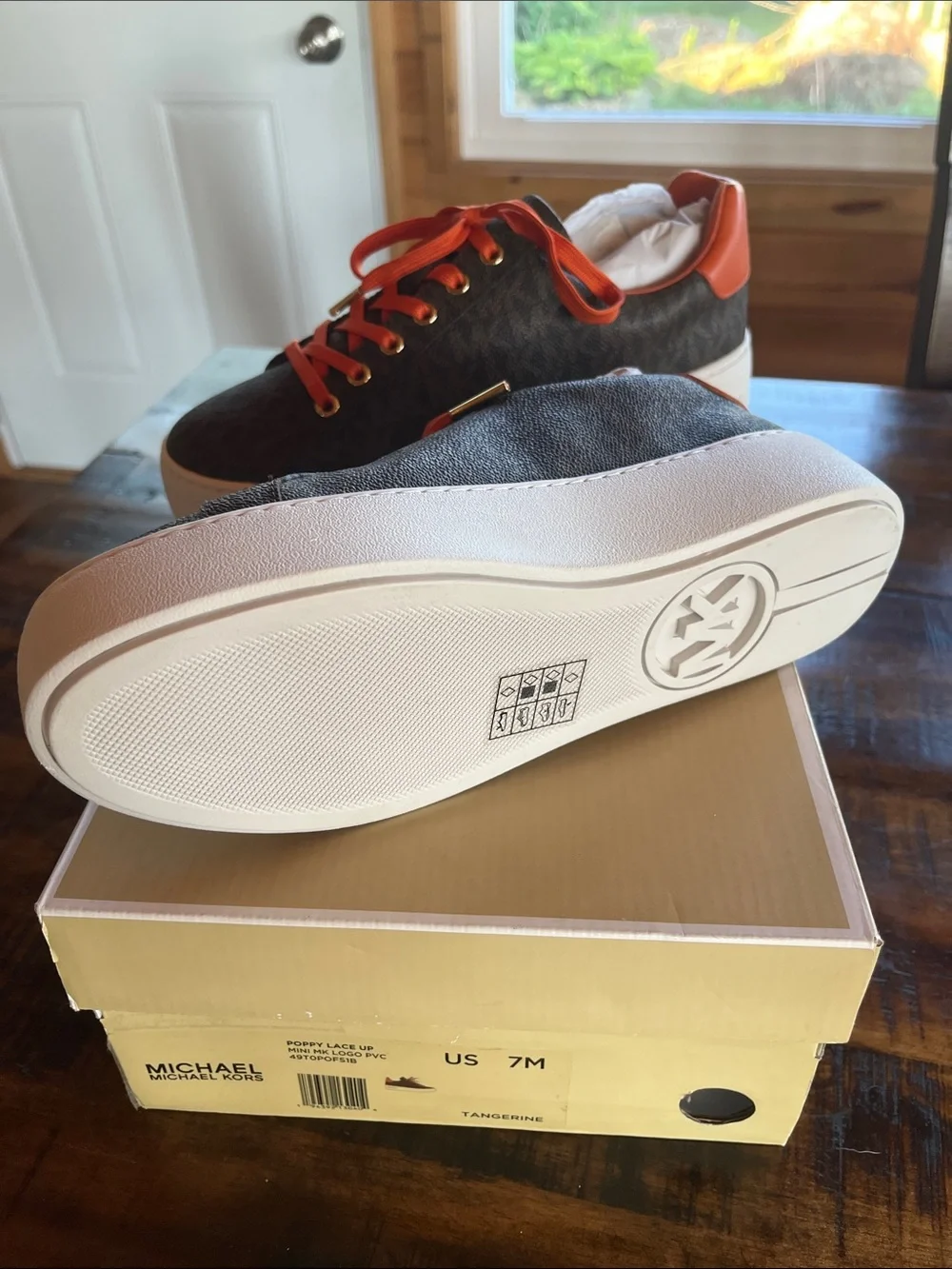 Michael Kors Woman’s Brown MK Monogram Sneaker with Orange Accents